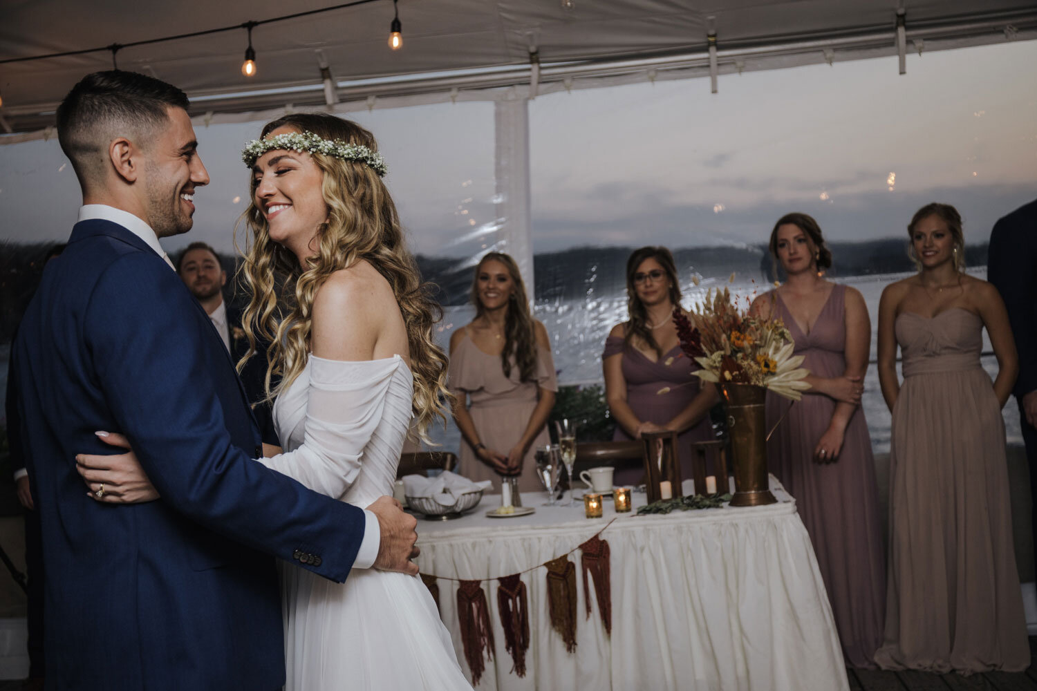 a birde and groom take their first dance
