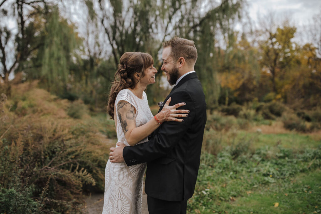 A couple laughs together while they get their portraits taken during their Lehigh Valley elopement