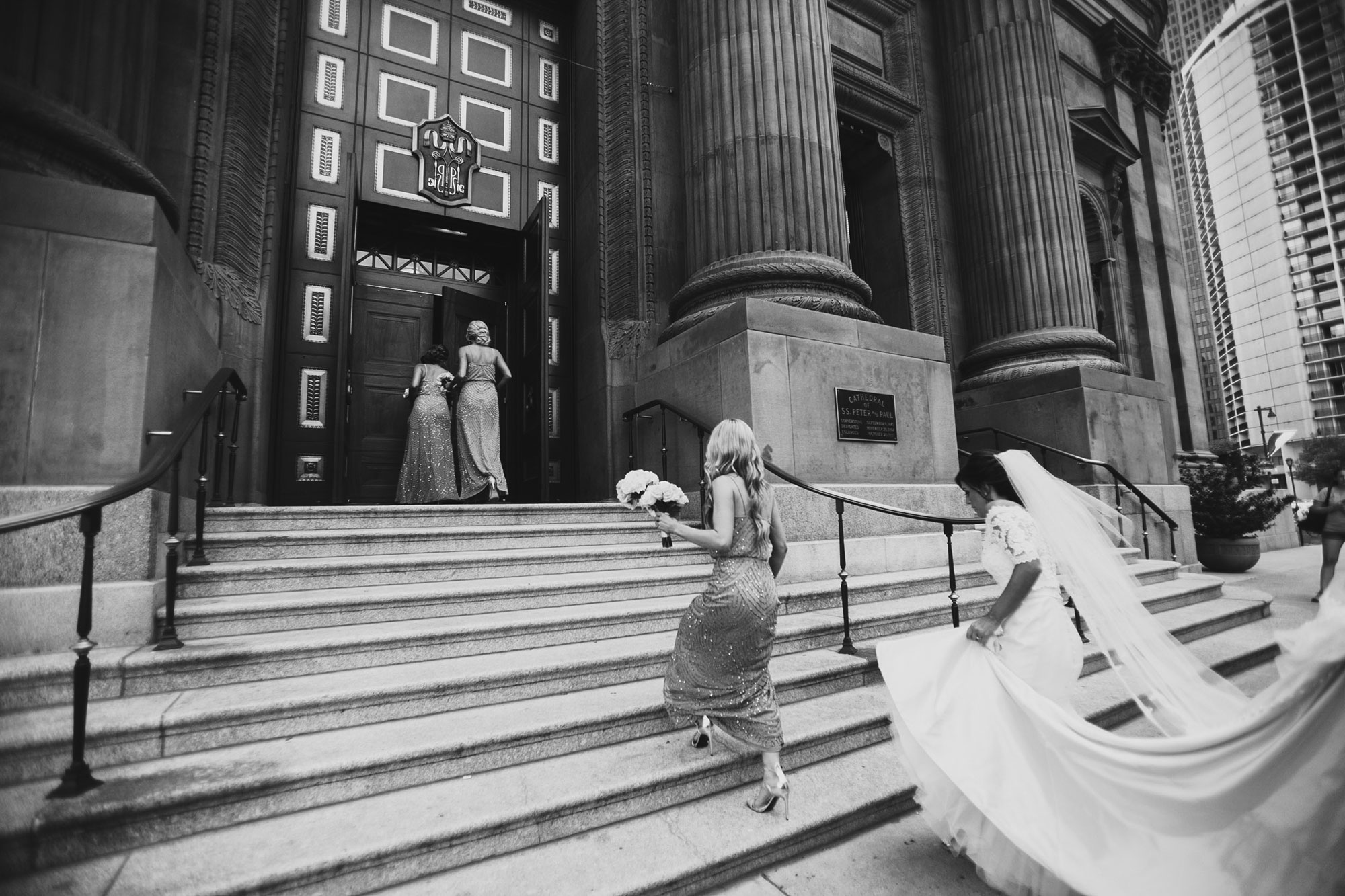 bride walking up the church steps