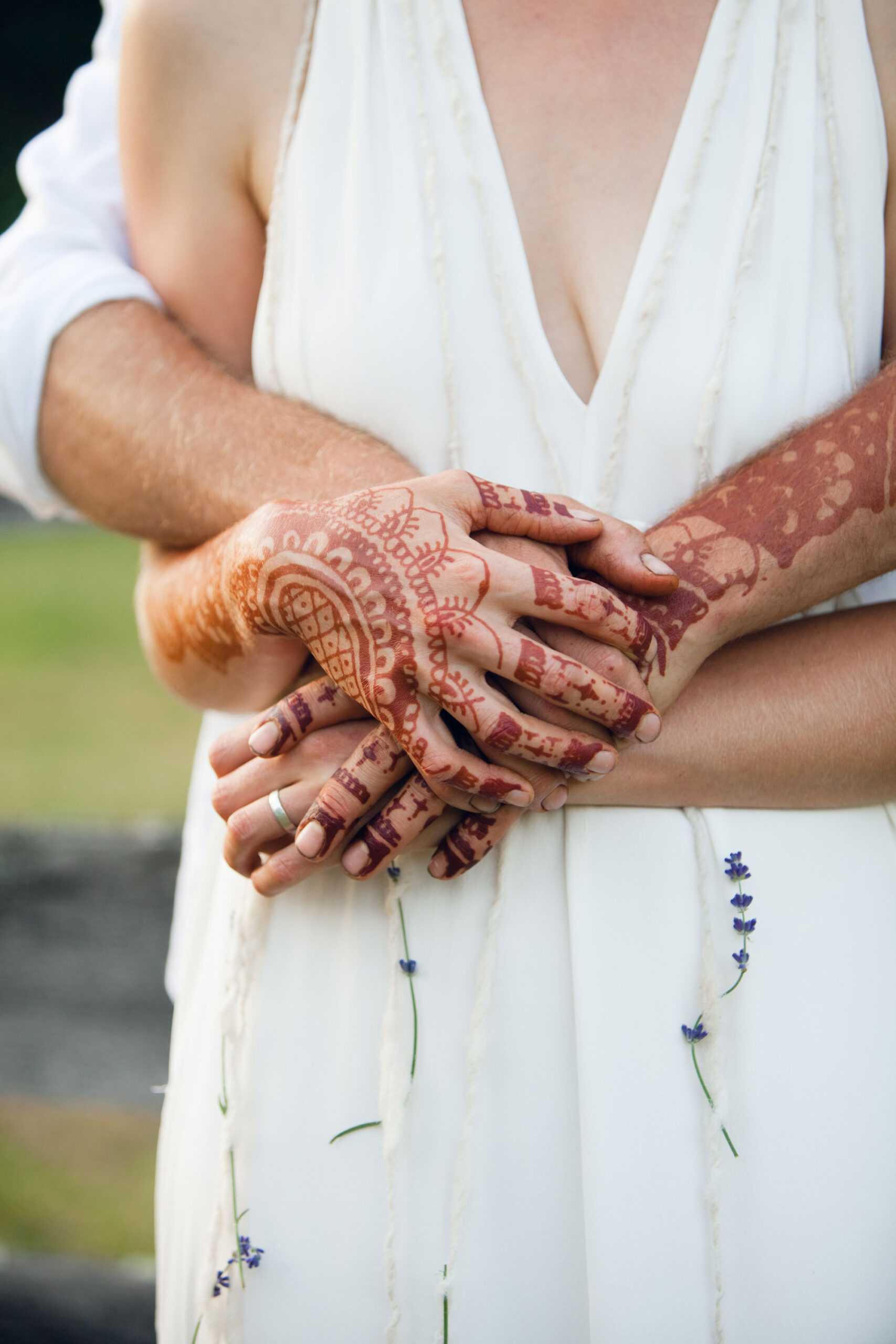 A detail of the bride and grooms hands