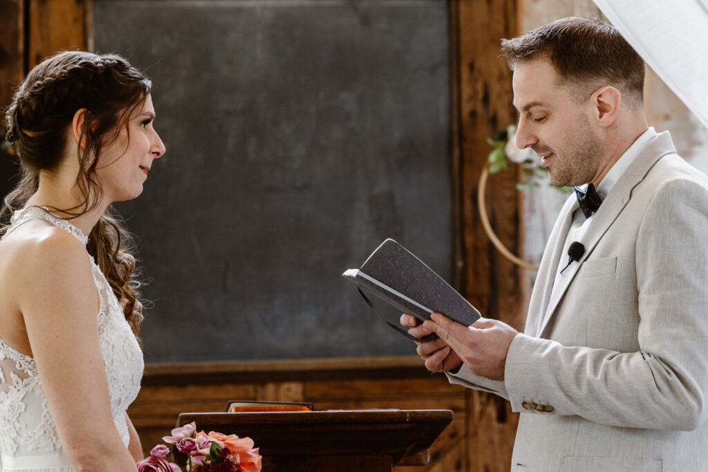 groom reading his private vowels during his elopement 