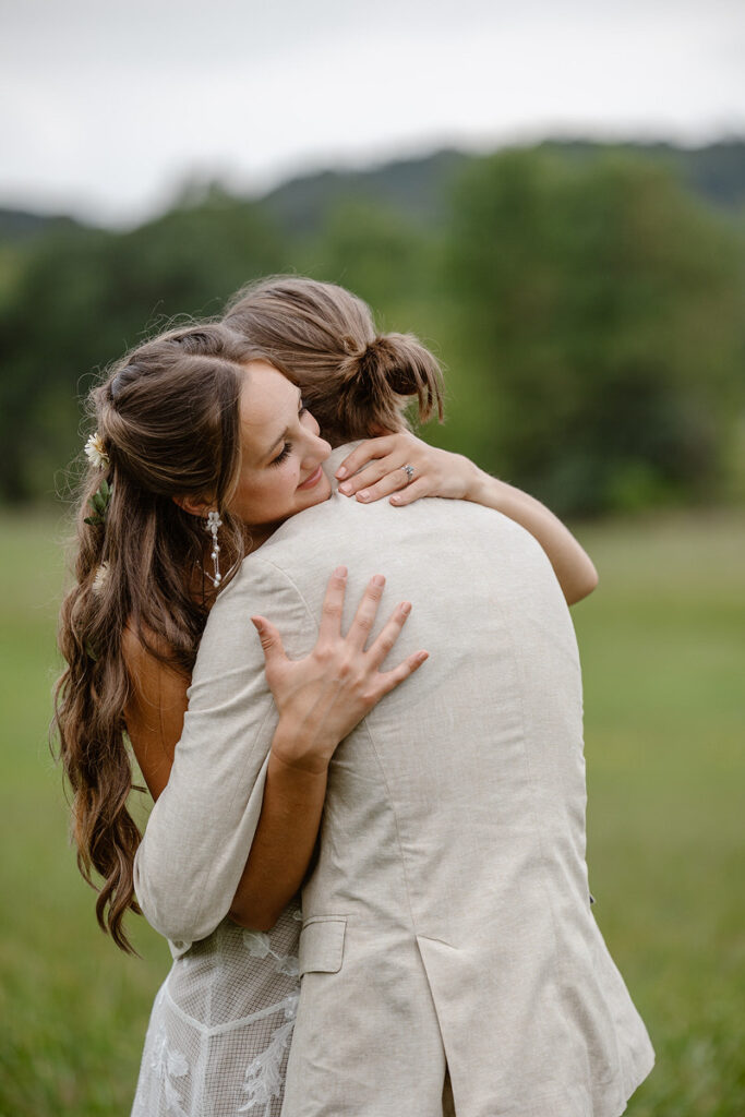 A newlywed couple hugging tightly 