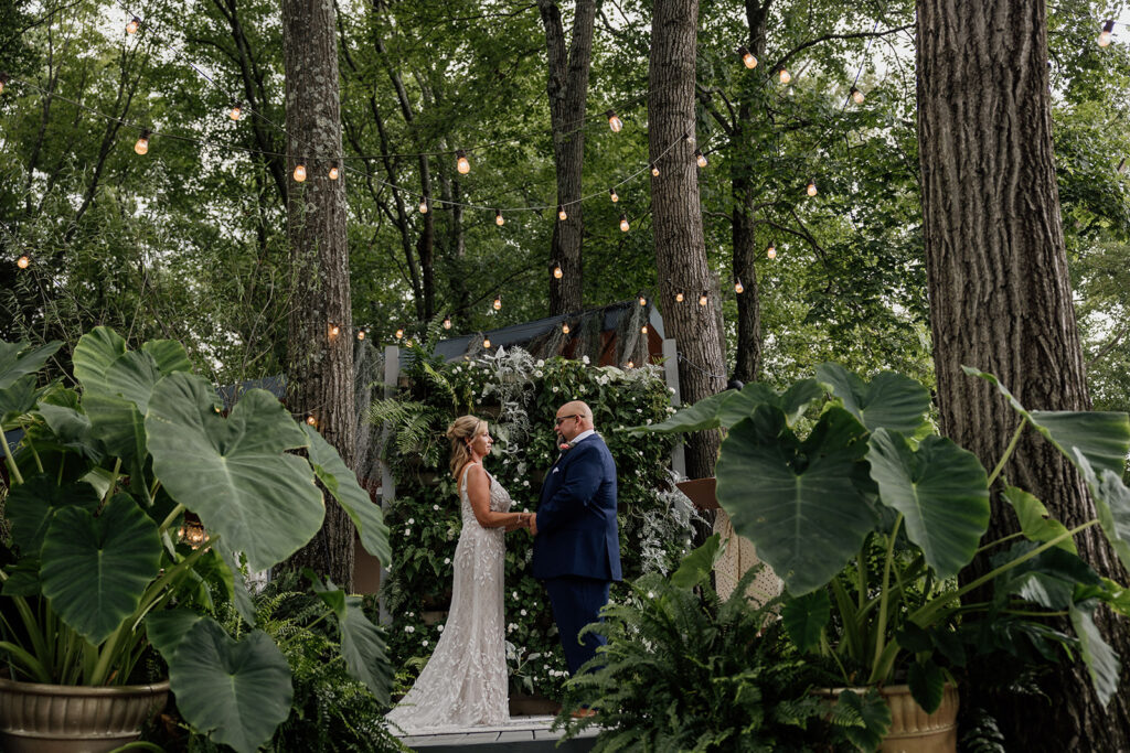 A bride and groom stand in the middle of the woods during their elopement in Pennsylvania.