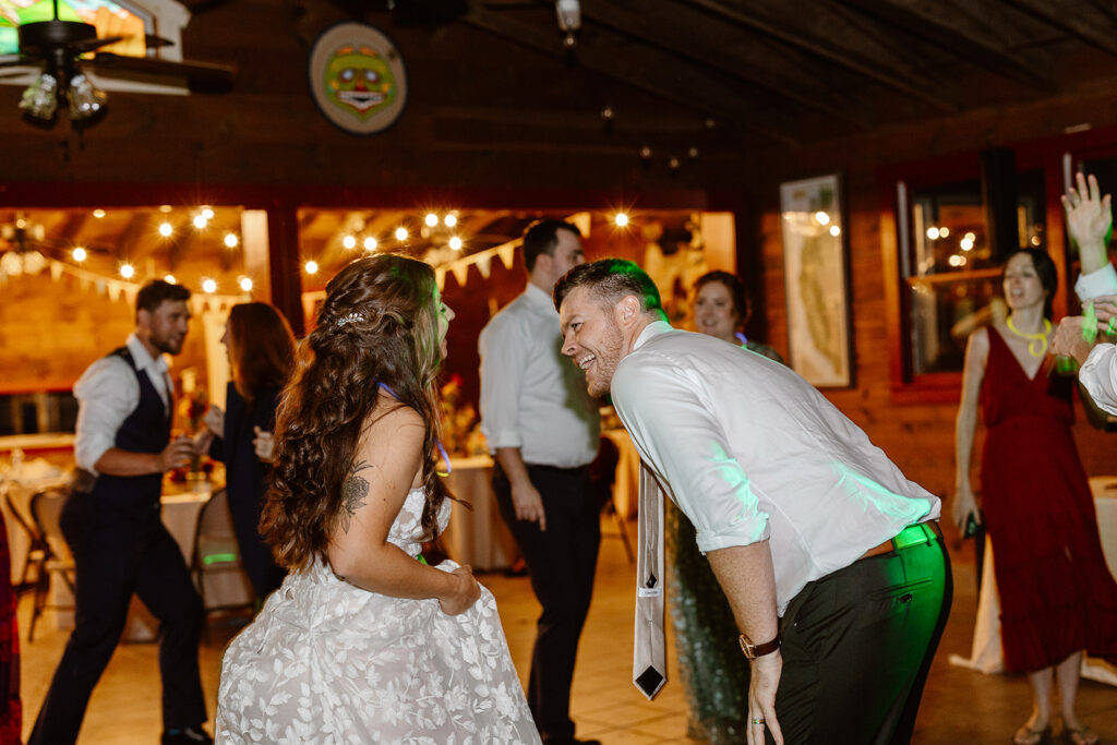 A bride and groom on the dance floor at their wedding reception. 