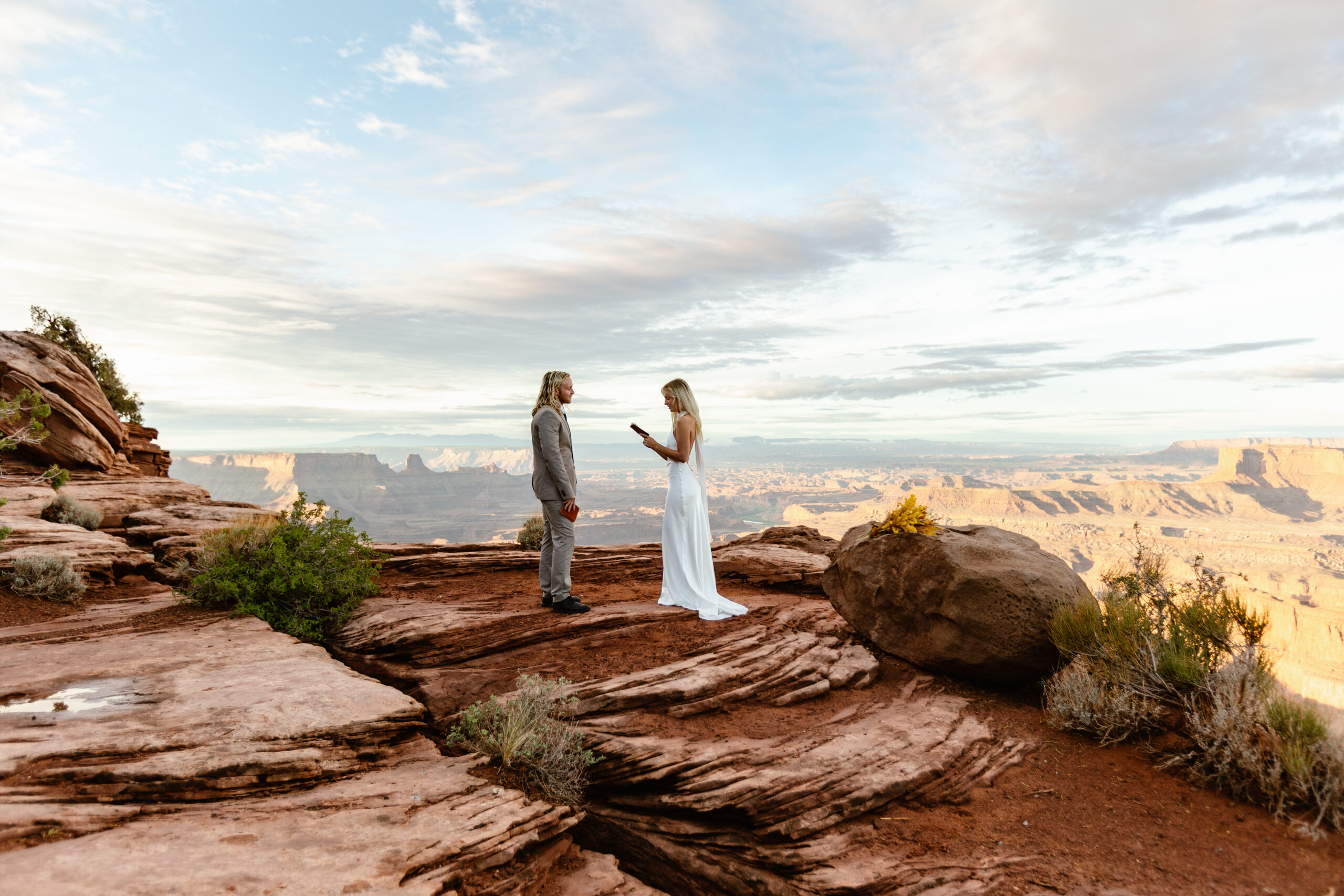 A bride and groom exchange vows in Moab during their elopement day