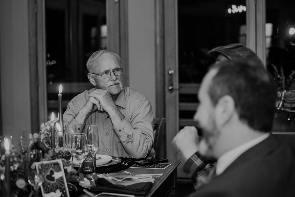 A photo of the grooms dad during the wedding reception. 