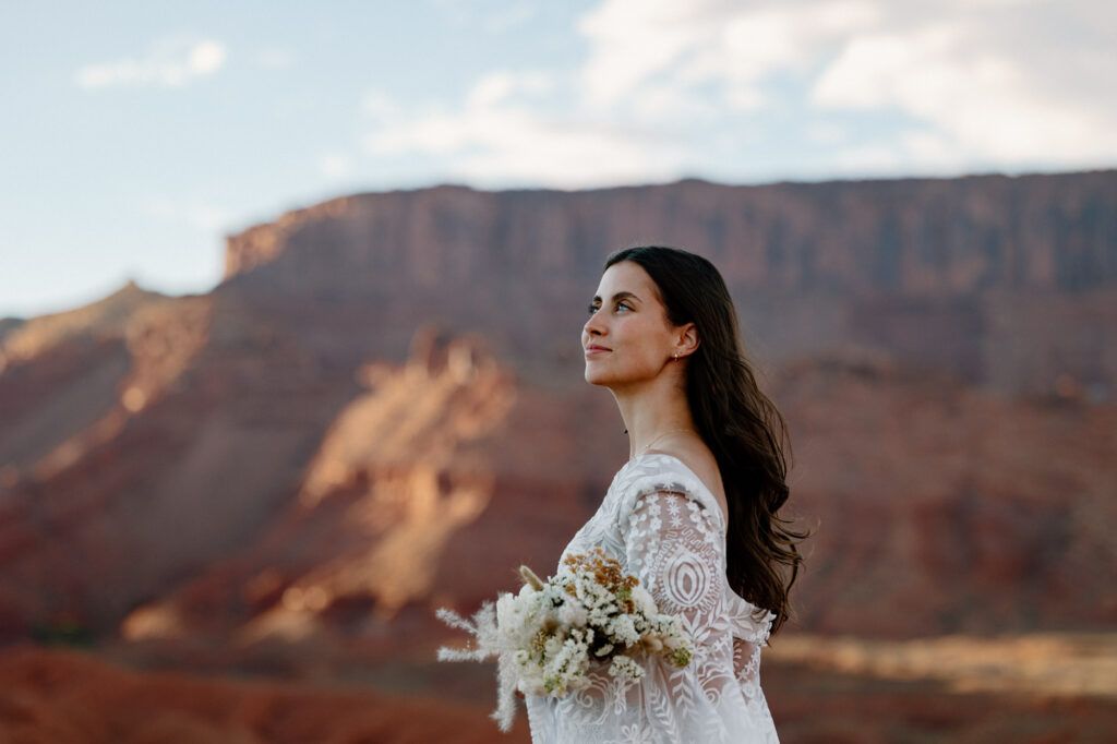 A portrait of a bride holding her bouquet on her elopement day