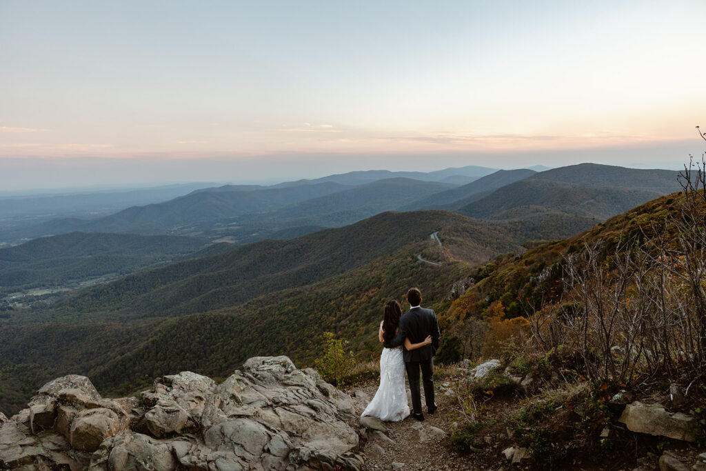 A bride and groom admire the view during their Shenandoah Elopement. Shenandoah Fall Colors