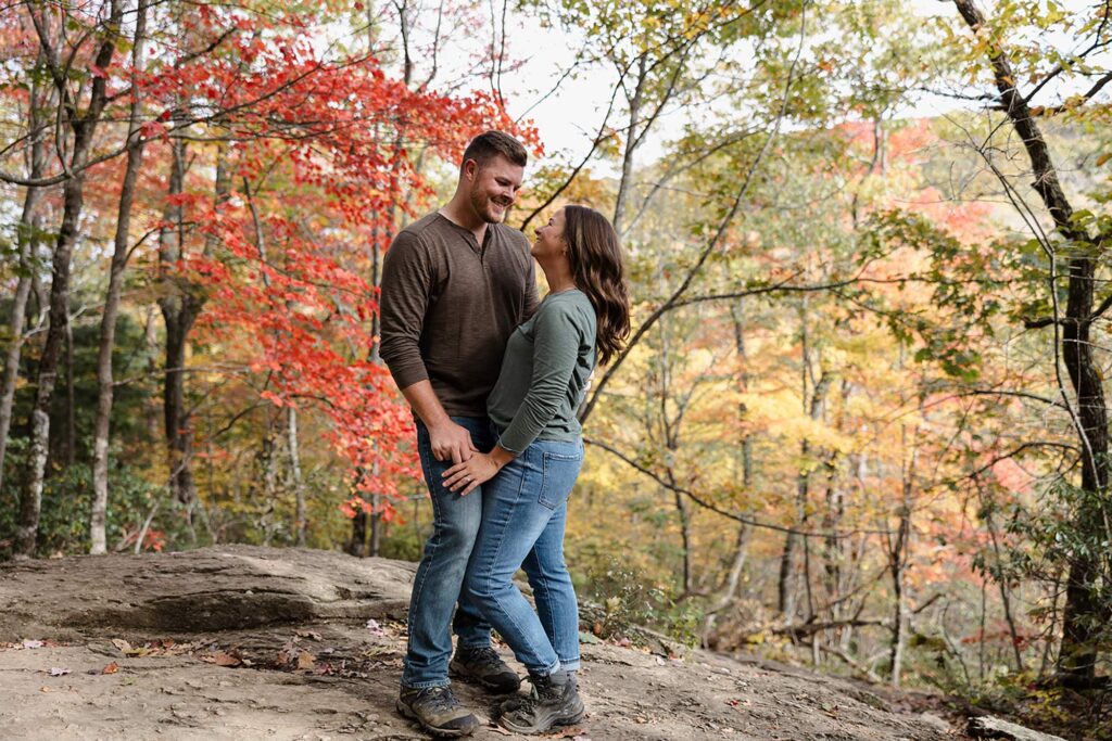 A couple faces one another surrounded by Shenandoah Fall Colors on their elopement day