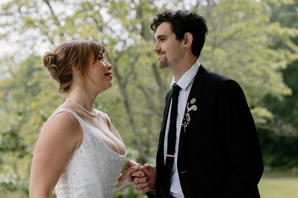 A bride and groom looking at one another during their elopement ceremony. 