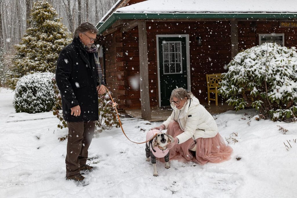 A dog sees her mom, the bride, for the first time on their elopement day.  The dog howls with excitement.