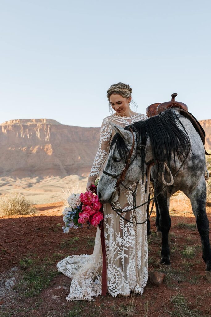 A horse smells a brides wedding day bouquet 