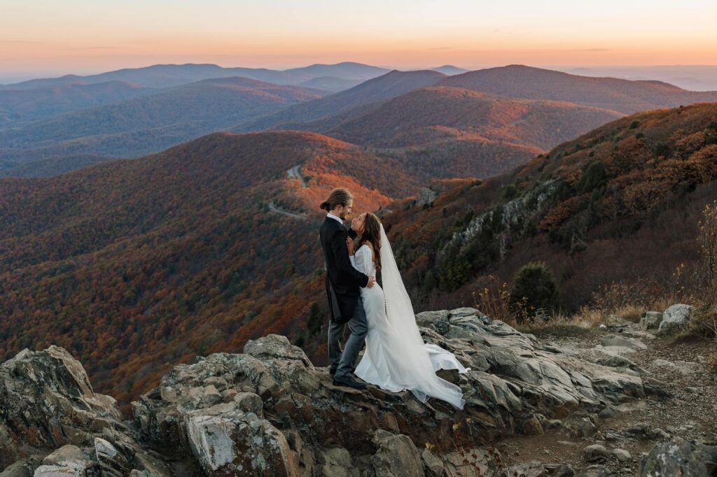 A bride and groom look into each others eyes as they say I do during their Virginia elopement