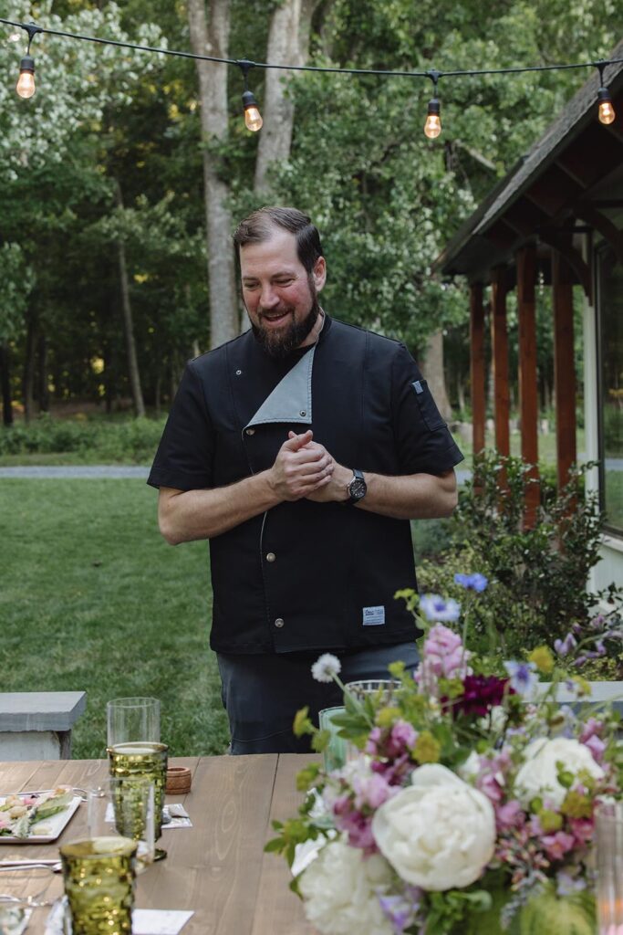 A private chef explains the course he has presented to the couple and their family during an intimate elopement dinner at indigo house