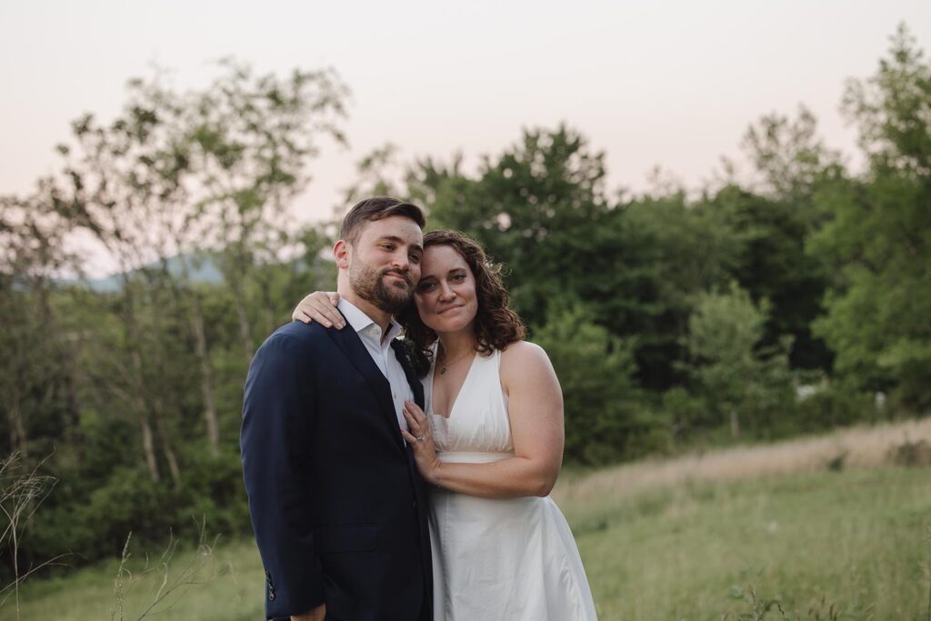 A bride and groom smile as the sunsets and their elopement day ends